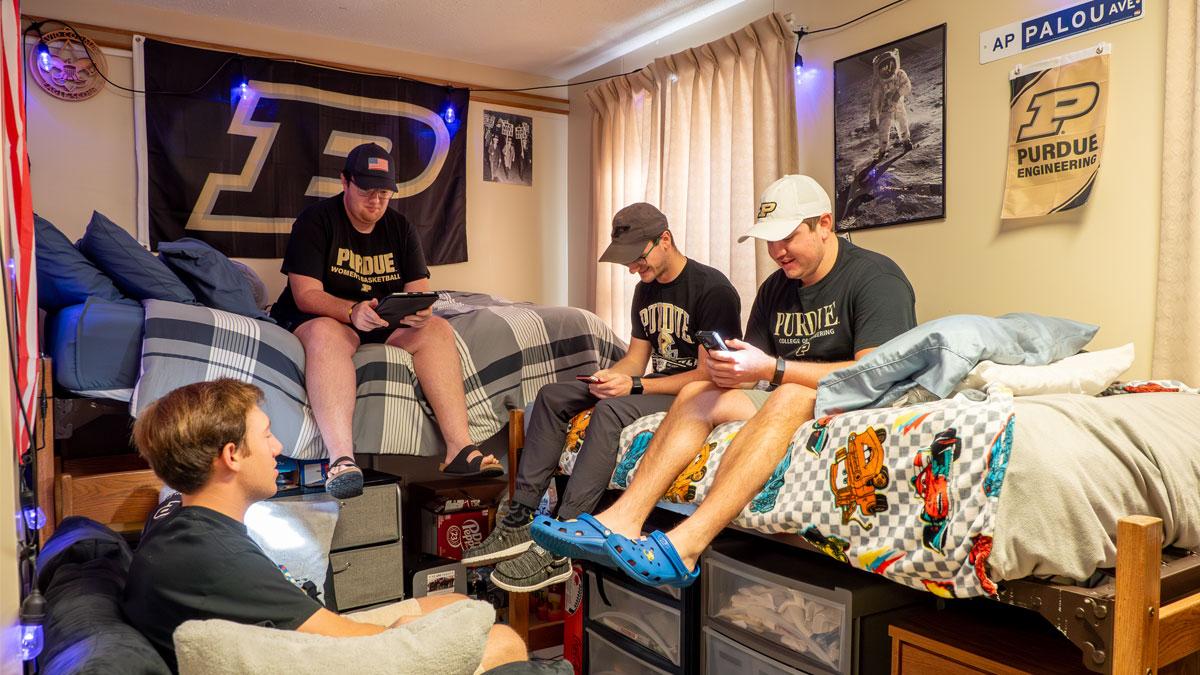Photo of Purdue students hanging out in their dorm room in Cary Quadrangle.