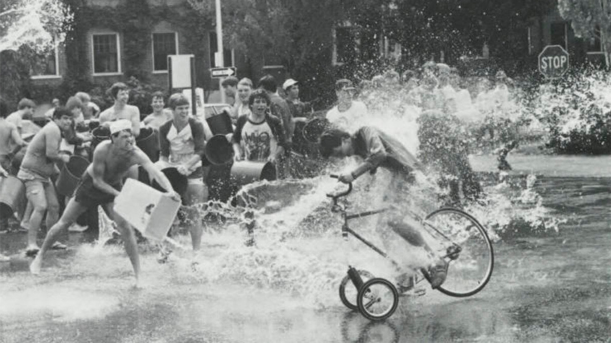 Students competing in the Cary Quad tricycle race.