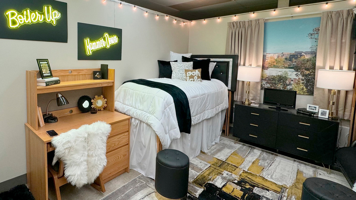 A show room decorated in Purdue items and colors