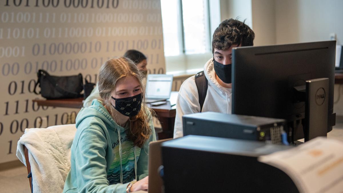 Photo of students collaborating in residence hall computer lab