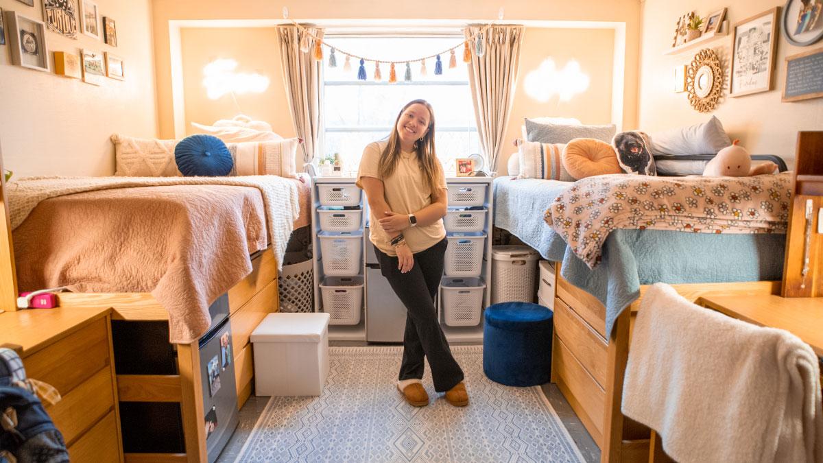 Photo of a student in a dorm room in Wiley residence hall.