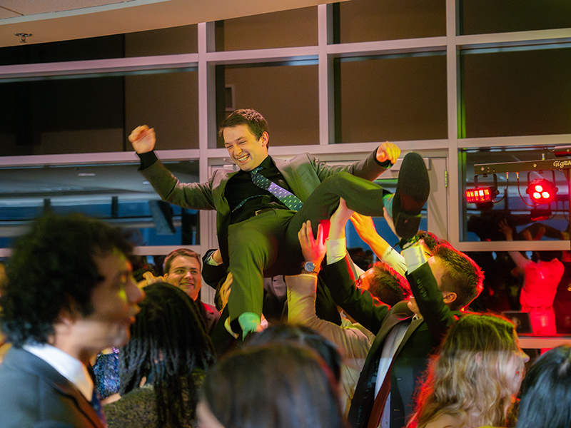 Student crowd surfs at the inaugural Rakosnik Legacy Gala