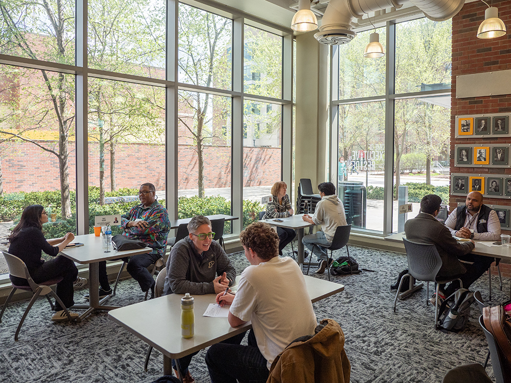 Executives visit with students during Coffee and Consulting sessions.