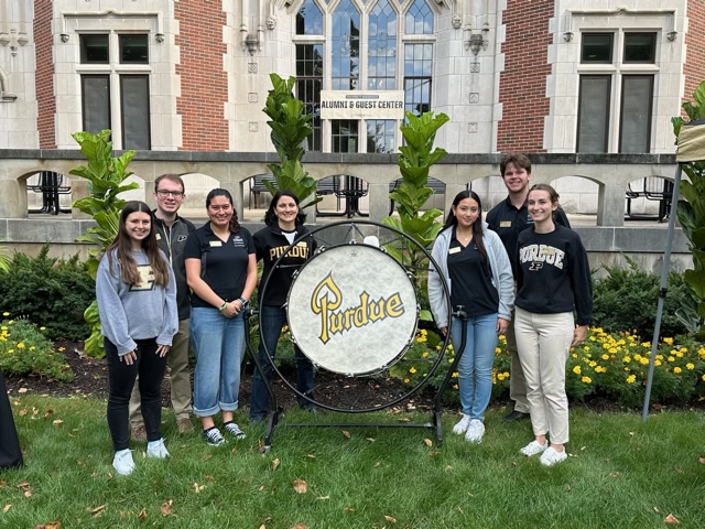 Group with mini bass drum in front of Cary. 