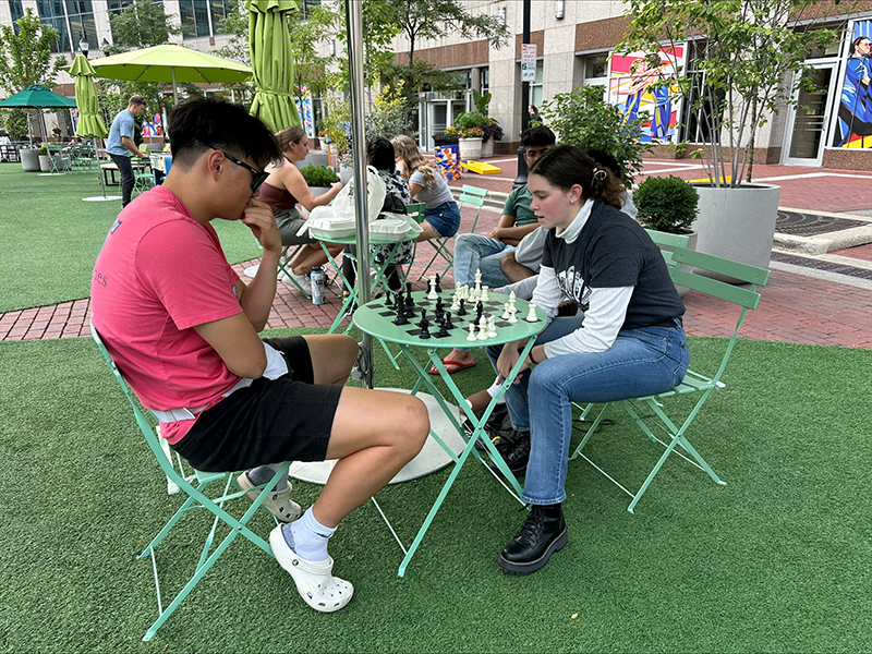 Students in Indianapolis enjoy a game of chess during move-in. 