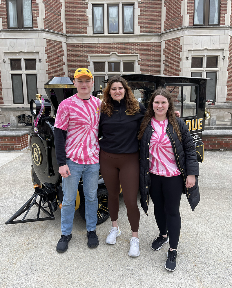 Anna Schnefke (center) with Jason Packard and Amanda Pisarczyk, directors of RHA's Wacky Dacky 5K Fun Run Walk Roll.