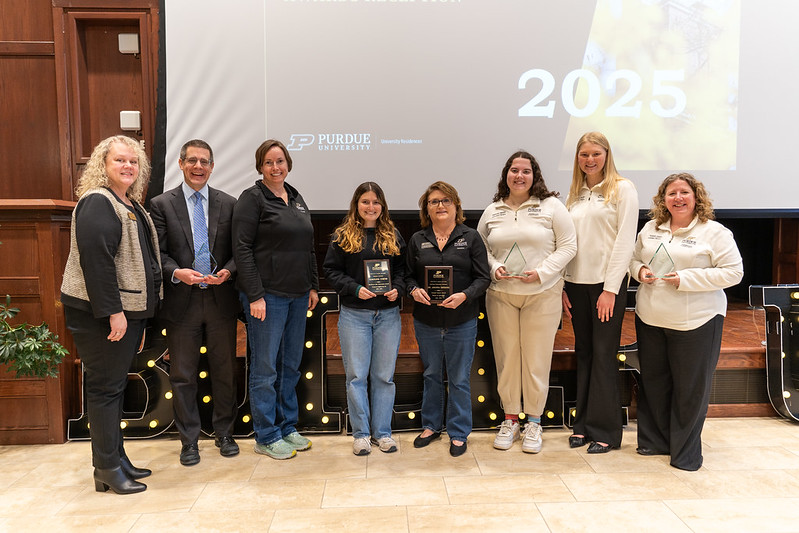 Students and staff lined up with their awards