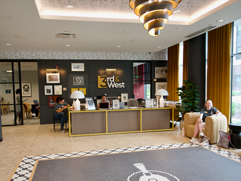 3rd and West lobby with students waiting to check in