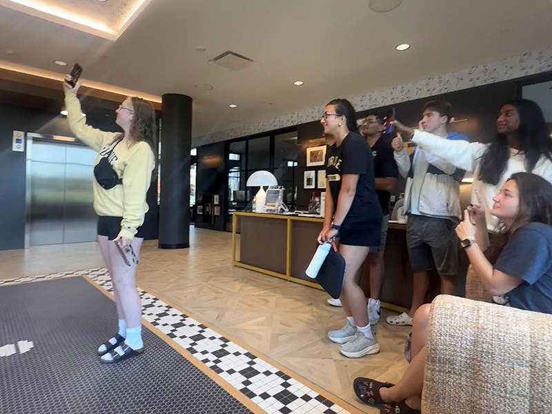 Students take selfie in lobby